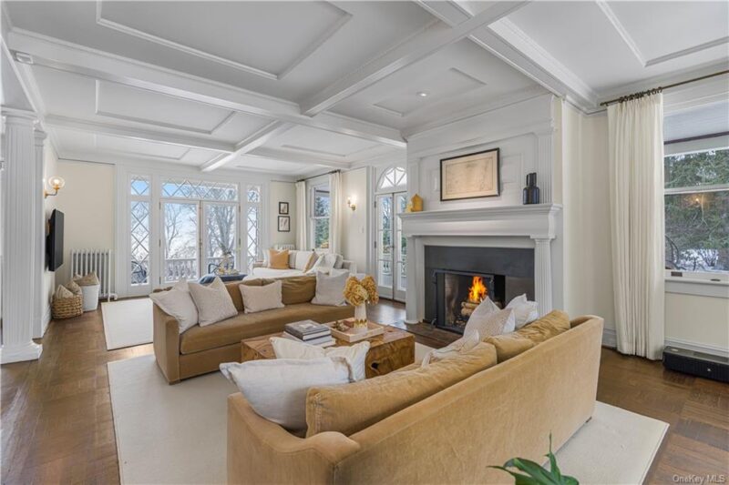 two sofas flanking a fireplace inside the Stepmom movie house