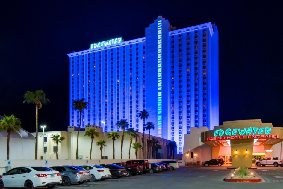 The Edgewater Casino's big building sits illuminated blue this holiday season