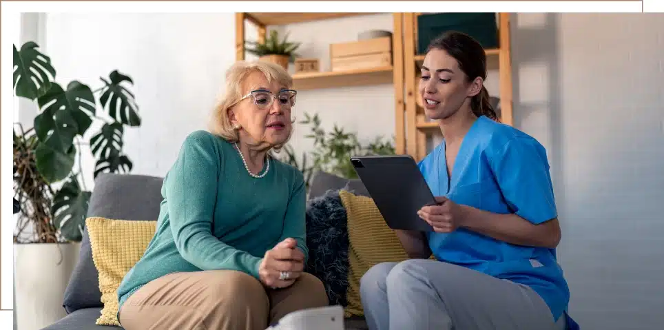 A woman reviewing long-term care and long-term disability insurance options with another person